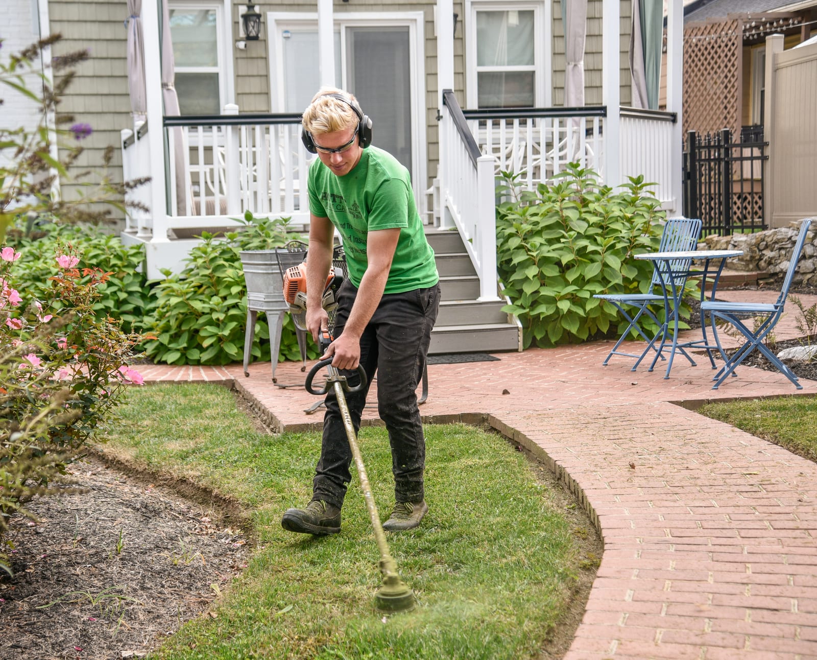 A gardener mowing the grass in London